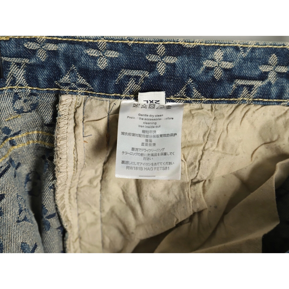 Louis Vuitton washed blue jeans with all-over print and side straps,Louis Vuitton